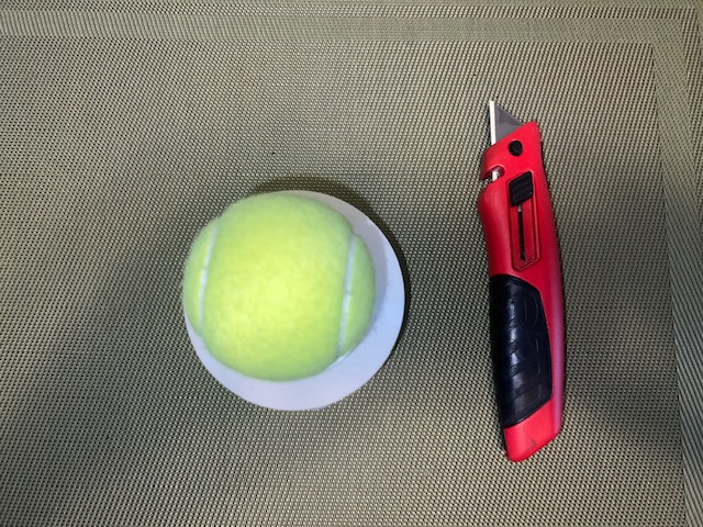 Ball in PVC pipe with box cutter